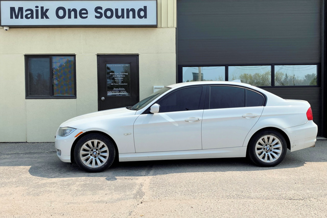 2009 BMW 323i with professional window tint in North Bay